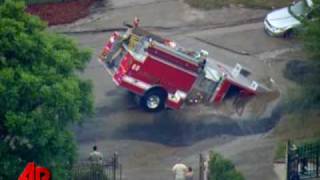 Raw Video Sinkhole Swallows Fire Truck [upl. by Hootman]